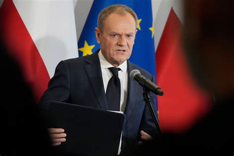 A day of 2 prime ministers in Poland begins the delayed transition to a centrist, pro-EU government